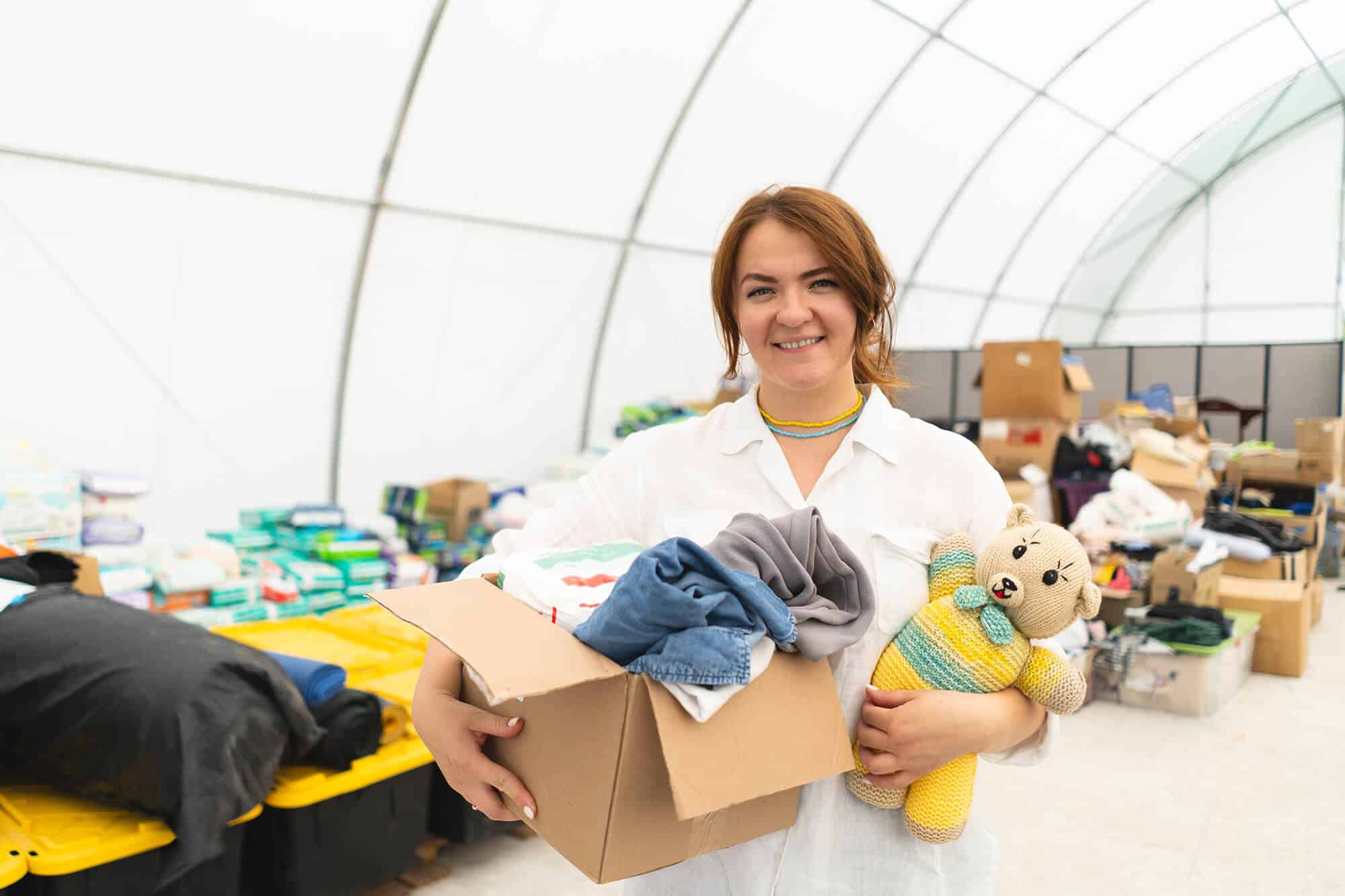 volunteer-woman-preparing-donation-boxes-for-peopl-2024-03-13-17-48-09-utc.jpeg